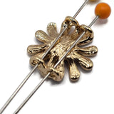 Stunning round Blue Flower Slider Beads featuring highly polished gold petals alternating with textured slate blue and charcoal blue enamel accents. Each decorative jewelry component showcases an elegant dimensional flower design with elongated petals and a raised metallic gold center. Wonderful focal beads for handmade bracelets, beaded necklaces, multi-strand jewelry, and creative bead weaving.
