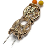 Beautiful charcoal gray and champagne enamel 2 Hole Slider Beads featuring an elegant abstract leaf design surrounded by highly polished bright gold metalwork. Each decorative focal bead combines connected oval frames, flowing branches, pearly ivory leaf accents, and small rounded gold details. These unique jewelry components are perfect for double-strand bracelets, necklace making, bead weaving, and creative jewelry designs.