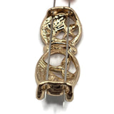 Decorative green botanical 2 Hole Slider Beads featuring connected oval frames with flowing gold branches, delicate enamel leaves, and contrasting sections of forest green, mint, and pearly ivory. The highly reflective bright gold finish beautifully complements the soft green color palette. These unique jewelry focal beads are excellent for handmade bracelets, necklaces, bead weaving, and decorative jewelry designs.