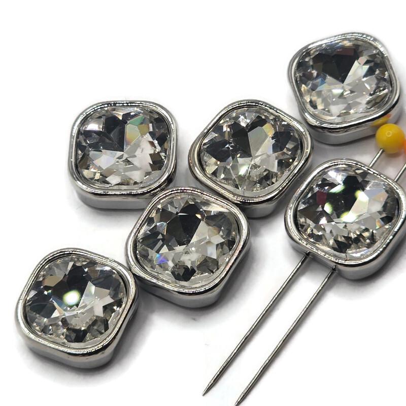 Beautiful platinum silver 2 Hole Slider Beads featuring large square cushion-cut clear rhinestones with brilliant reflective facets. The crystal-clear stones sparkle with flashes of white, silver, and subtle rainbow reflections, surrounded by smooth polished platinum silver settings. These substantial decorative jewelry focal beads are perfect for handmade bracelets, necklaces, bead weaving, and multi-strand jewelry designs.
