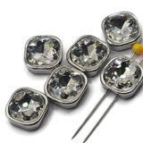 Beautiful platinum silver 2 Hole Slider Beads featuring large square cushion-cut clear rhinestones with brilliant reflective facets. The crystal-clear stones sparkle with flashes of white, silver, and subtle rainbow reflections, surrounded by smooth polished platinum silver settings. These substantial decorative jewelry focal beads are perfect for handmade bracelets, necklaces, bead weaving, and multi-strand jewelry designs.