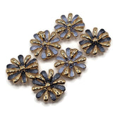 Decorative blue enamel 2 Hole Slider Beads featuring beautiful daisy-style flowers with alternating smooth gold and textured blue petals. The mixed package includes complementary light dusty blue and dark smoky blue enamel variations, creating attractive floral jewelry components. These unique focal beads are excellent for bracelet making, necklace designs, bead weaving, and handmade gifts.