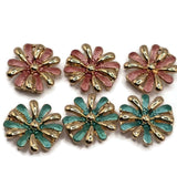 Stunning round Pink and Teal Flower Slider Beads featuring highly polished gold petals alternating with textured dusty pink and turquoise green enamel accents. Each decorative jewelry component showcases a dimensional daisy-style flower design with elongated petals and a raised metallic gold center. Wonderful focal beads for handmade bracelets, beaded necklaces, multi-strand jewelry, and creative bead weaving.