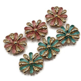 Beautiful pink and teal enamel flower 2 Hole Slider Beads featuring alternating textured dusty rose pink, turquoise teal, and highly polished bright gold petals. This colorful package includes three pink and three teal floral jewelry focal beads with dimensional daisy-inspired designs and raised gold centers. Perfect jewelry making supplies for handmade bracelets, necklace designs, bead weaving, and multi-strand jewelry projects.