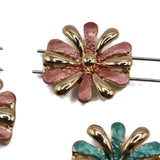 Decorative pink and turquoise teal enamel 2 Hole Slider Beads featuring beautiful daisy-inspired flowers with alternating smooth gold and textured colorful petals. The mixed package includes three warm dusty rose flowers and three rich teal green flowers for coordinated jewelry making designs. These unique focal beads are excellent for bracelet making, necklace designs, bead weaving, and handmade gifts. Beautiful jewelry components for spring accessories, botanical jewelry, and artisan projects.