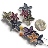 Decorative bright silver floral slider beads featuring three dimensional overlapping flowers with textured enamel petals in assorted coordinating colors. Deep midnight blue blossoms contrast with rich burgundy, violet purple, soft peach, and smoky olive gray accents. The polished silver outlines enhance the shape and detail of each flower.