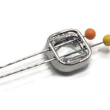 Sparkling clear rhinestone jewelry-making beads featuring substantial square cushion-cut stones set in polished platinum silver metal. The brilliant faceted surfaces reflect bright white and silver highlights, creating a classic crystal-like appearance. These decorative 2 Hole Slider Beads provide beautiful sparkle and dimension for handmade bracelets, necklaces, decorative cuffs, and bead weaving.