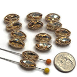 Close-up of bright gold champagne rhinestone slider beads featuring two elongated marquise-shaped faceted stones. Each decorative focal bead showcases warm golden champagne rhinestones with brilliant reflective facets and delicate textured gold borders. The compact double-stone arrangement creates an elegant geometric appearance. Beautiful 2 hole slider beads for double-strand bracelets, necklaces, bead weaving, and handmade jewelry designs.