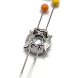 Detailed view of platinum silver 2 hole slider beads featuring brilliant clear round rhinestones. The polished stainless steel-colored metal settings surround each faceted stone, creating a classic silver and clear crystal appearance. These decorative 12 mm jewelry-making beads are ideal for double-strand bracelets, crystal bead weaving, bridal accessories, and elegant handmade jewelry designs.