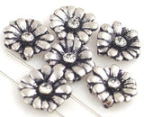 Elegant daisy 2‑hole slider beads with recessed oxidation and crystal centers for a balanced radiant effect. Ideal for double‑strand bracelets, chokers, or layered necklaces. Their sturdy structure, light weight, and intricate floral form make them perfect for versatile jewelry—from boho chic to upscale handmade classics.