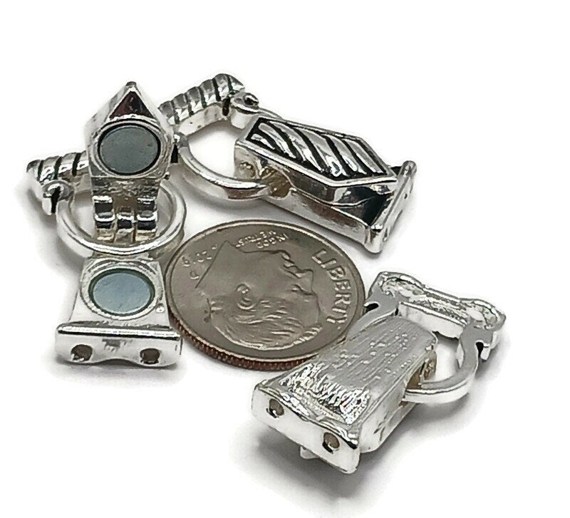 Silver fold over magnetic clasps with true double‑strand design. Each end has 2 holes for parallel beading wire or chain, plus rear cutouts to hide knots or crimp tubes. Click‑to‑lock lid adds security over basic magnets. Ideal magnetic bracelet clasps and magnetic necklace clasps for stringing, bead weaving, and leather. Low‑profile, snag‑resistant finish for everyday jewelry making and repairs.